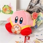 Peluche rosa Kirby, sentado con bastón de caramelo